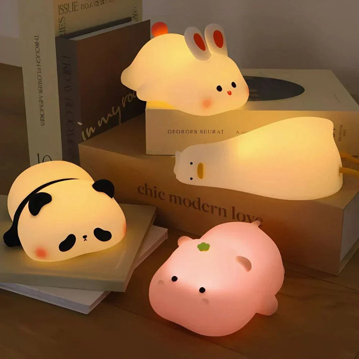 Soft silicone animal LED night light for kids; gentle tap dimming, portable & rechargeable.