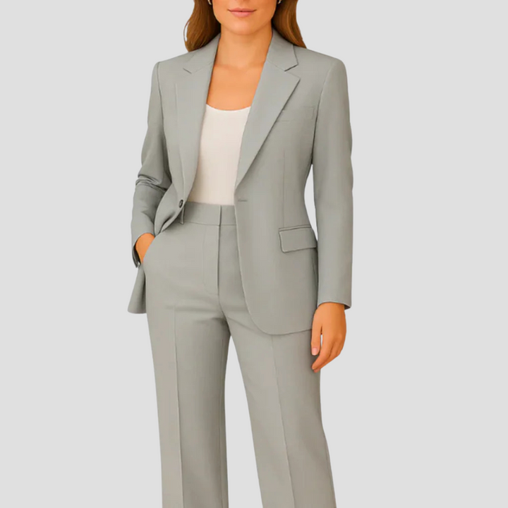 Professional women's two-piece suit. Tailored blazer and trousers create an elegant, business-ready formal look.