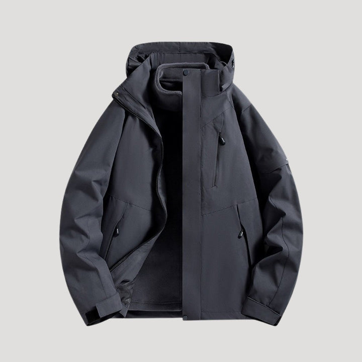 Unisex waterproof hooded jacket. All-season outdoor rain coat with versatile design for weather protection.