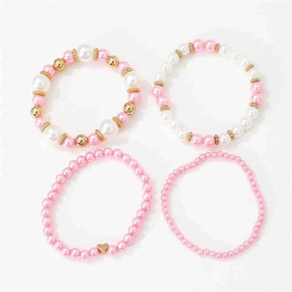 Beautiful women's 4-piece faux pearl & heart beaded bracelet set. White layered jewelry, fashion accessory.