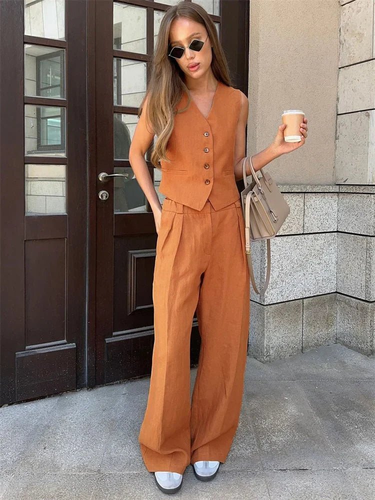 Fashionable women's vest set featuring a tailored top and breezy pleated wide-leg pants.