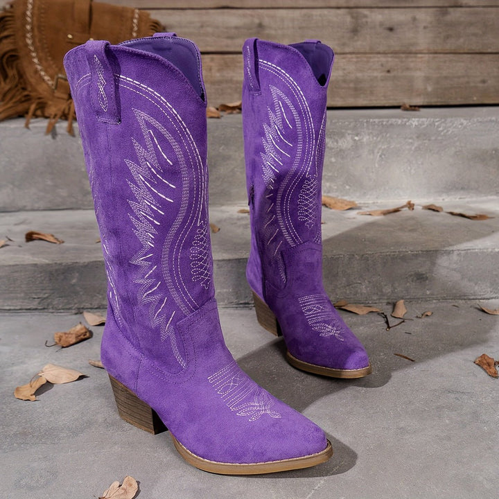 Chic women's tall cowboy boots with a distinct pointed toe design & intricate western embroidery for a stylish look.