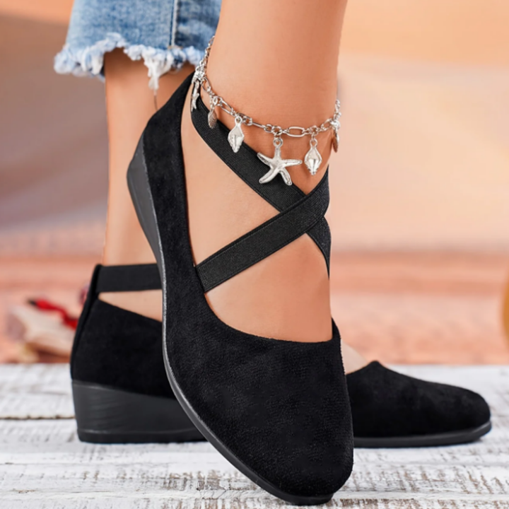 Comfortable women's slip-on ballet flats featuring a compensated heel, ideal for versatile casual or office wear.