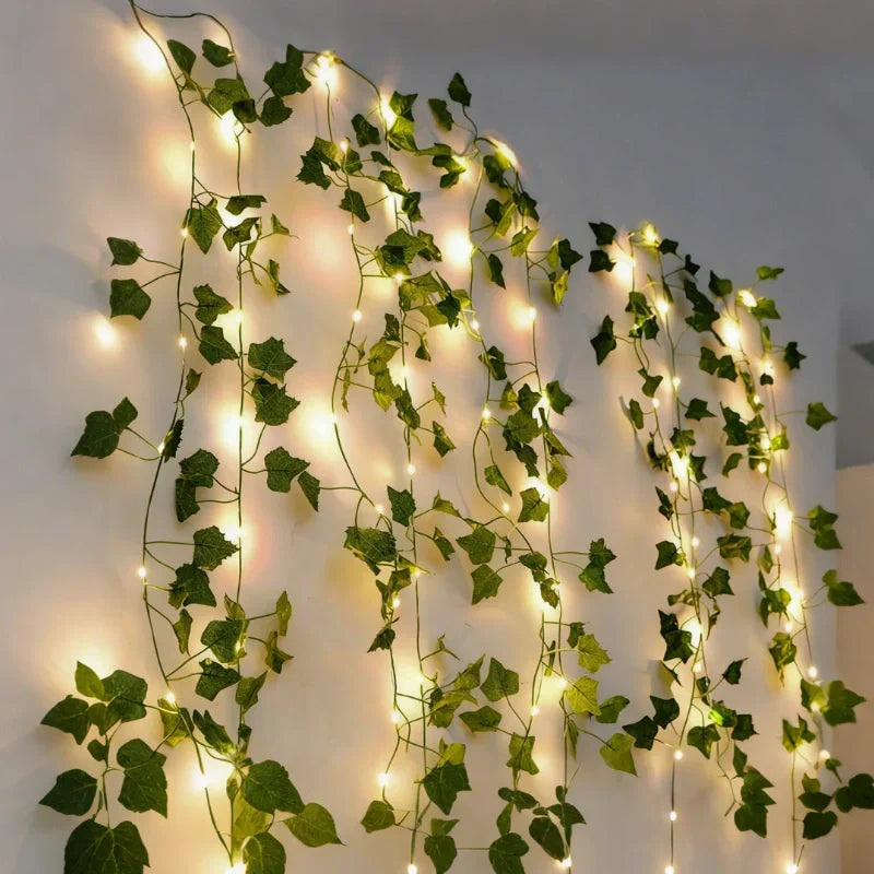 Battery operated LED vine lights with delicate warm white leaves for festive decor.