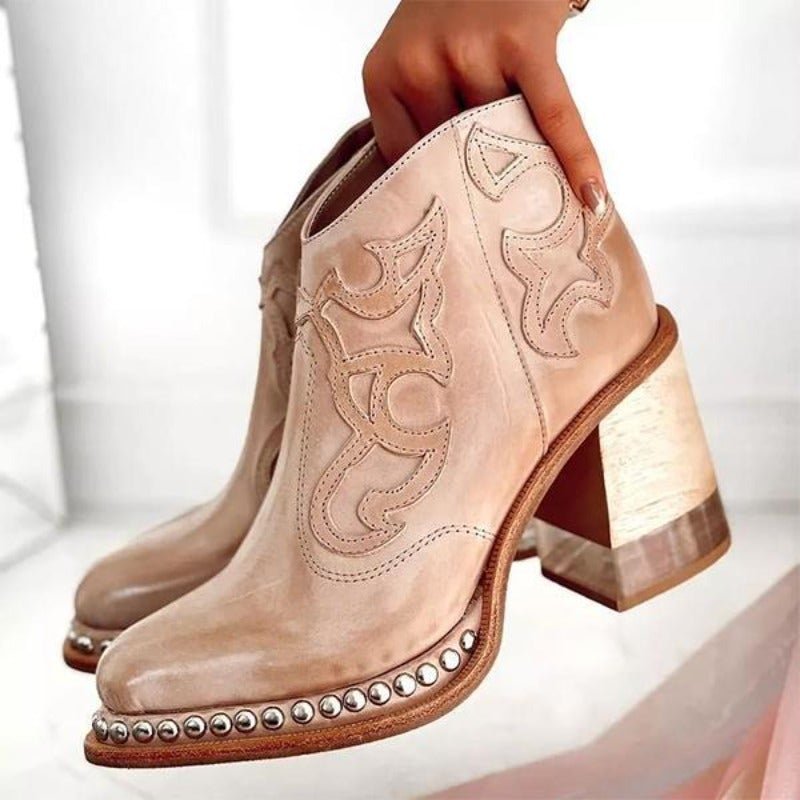 Fashion-forward women's cut-out ankle boots, cowboy-inspired with a sturdy block heel.