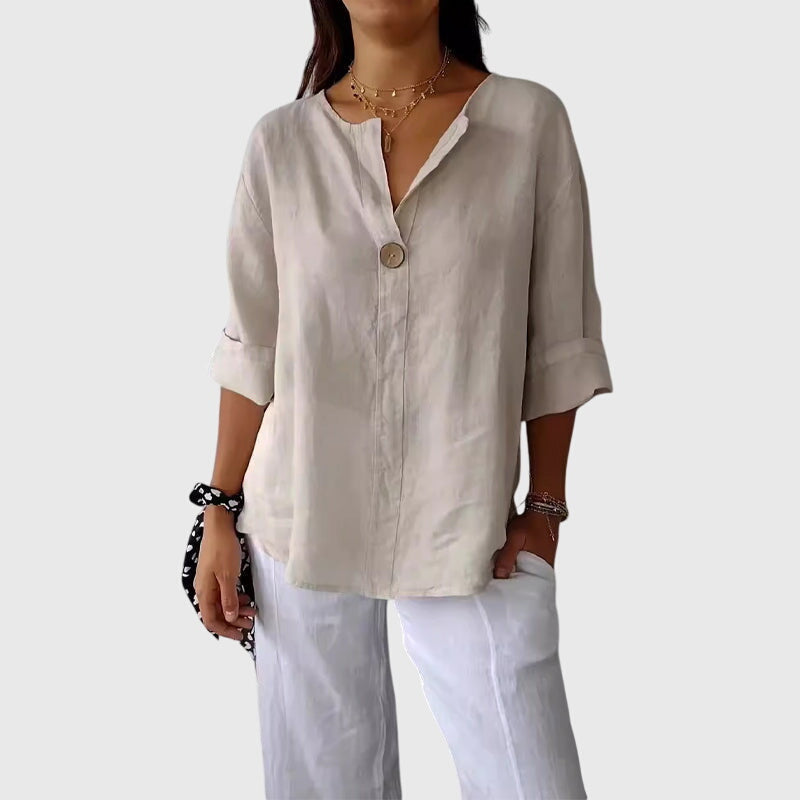 Elegant women's V-neck blouse with single button closure, long sleeves, perfect for office wear or chic casual outfits.