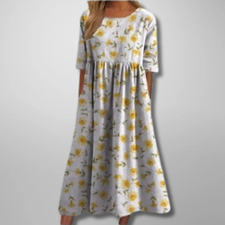 Spring/Summer floral midi dress for women. Relaxed fit, flowing design. Versatile & elegant in mint green.