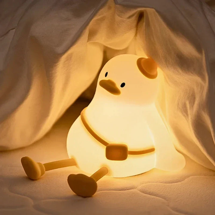 Dimmable silicone animal night light, tap control; soft LED glow for kids' bedroom or nursery.
