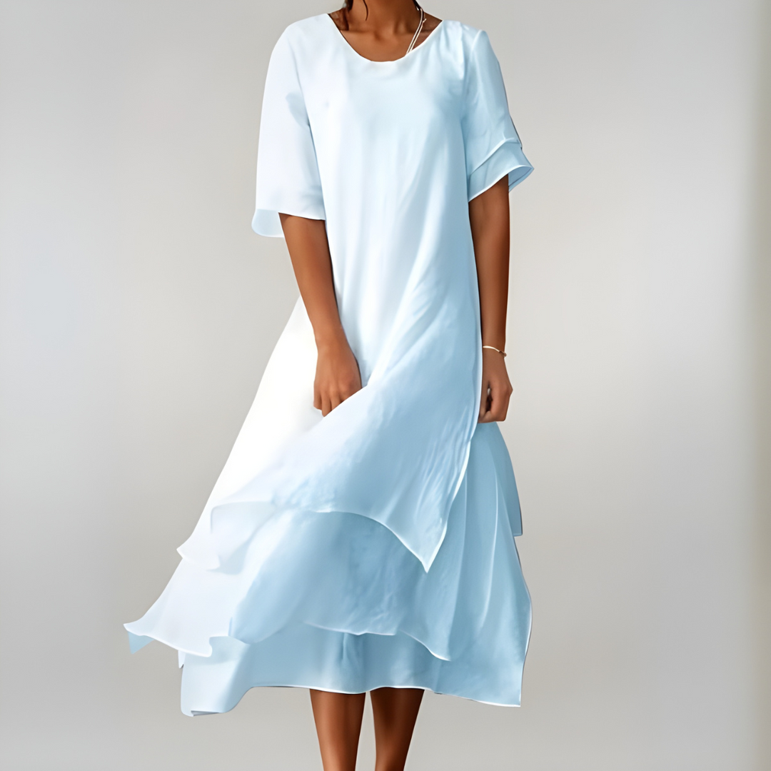 Stylish women's blue maxi dress. Flowing, lightweight, and elegant, ideal for summer fashion and comfortable wear.