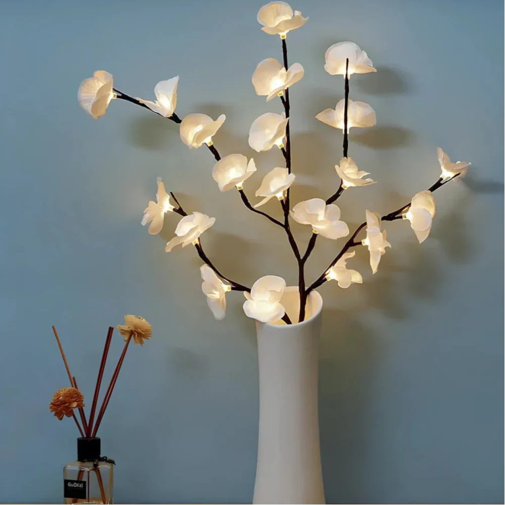 Floral home decor featuring warm white LED twig lights, creating a serene atmosphere.