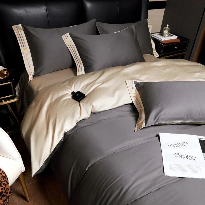 Premium cotton bedding set with elegant embroidery, includes soft duvet cover & matching pillow shams.