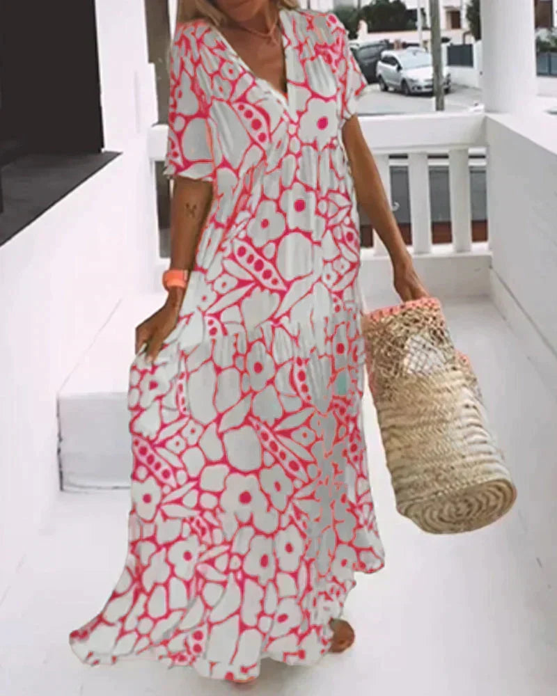 Full-length view of a women's flowy maxi dress, a perfect short-sleeve lightweight summer casual dress.