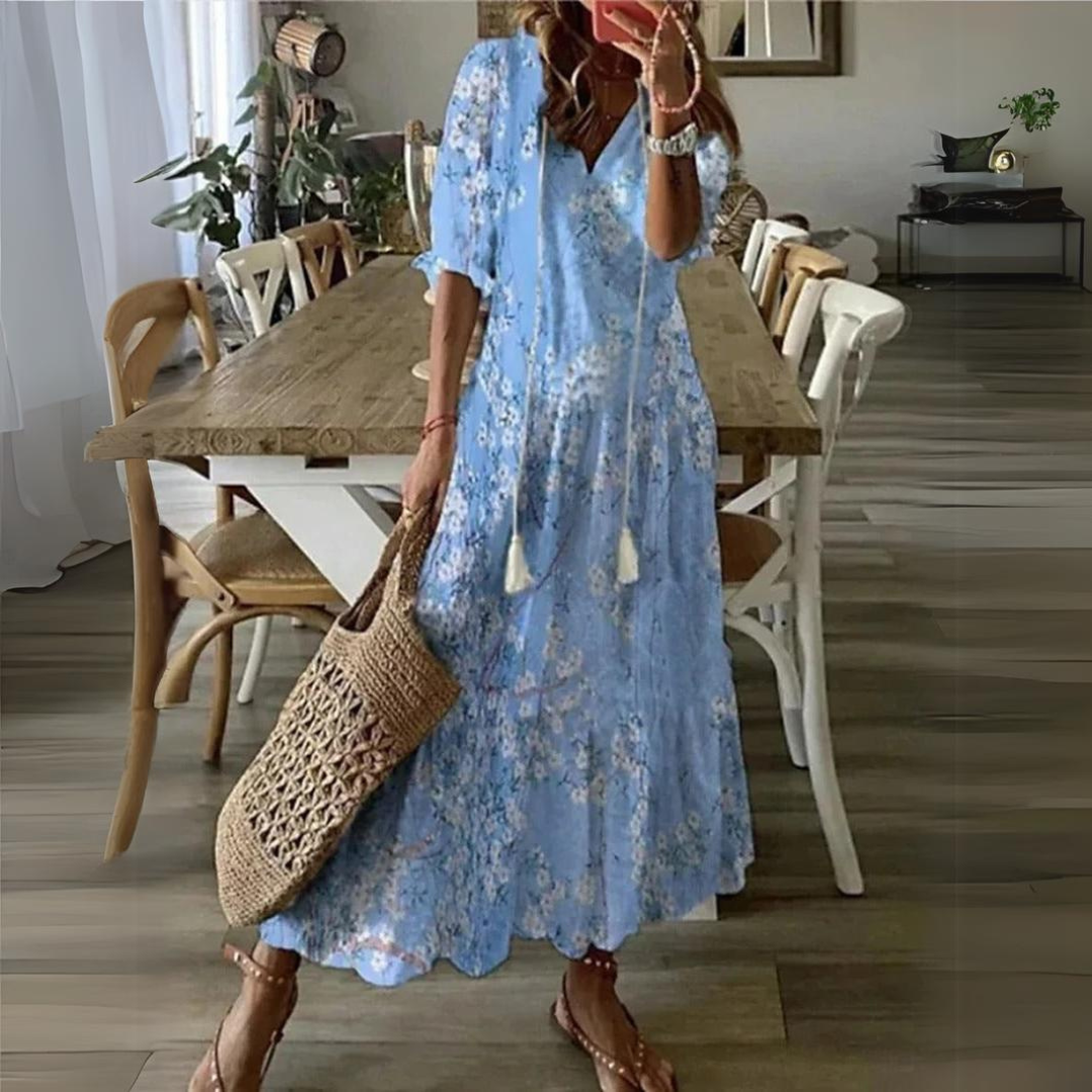 Women's floral print maxi dress, V-neck, short sleeve. Effortless summer style for casual wear & beach.