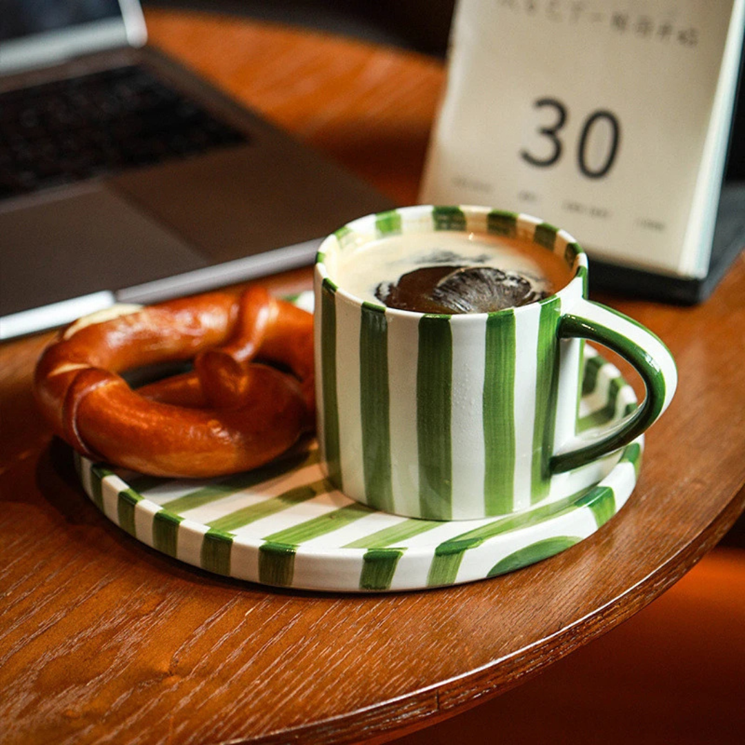 Elegant retro chic hand-painted ceramic coffee cup and saucer set, perfect for tea or coffee.