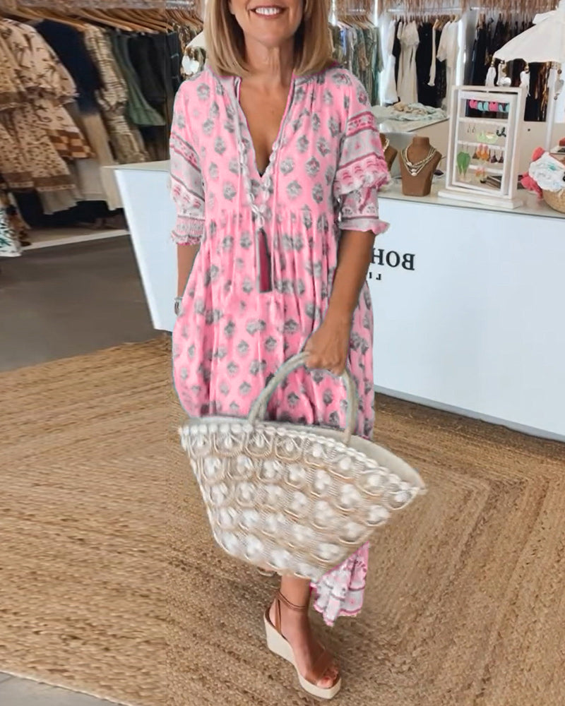 Lightweight women's printed V-neck half sleeve dress. Ideal summer dress for effortless, comfortable style.