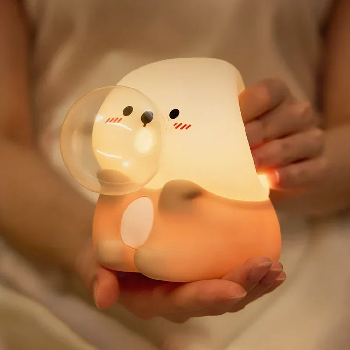 Silicone animal bedside lamp with LED; tap dimming, soft light for a cozy nursery atmosphere.