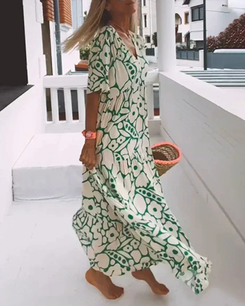 Women's short-sleeve maxi dress in a vibrant color, flowy, lightweight, and comfortable for summer days.