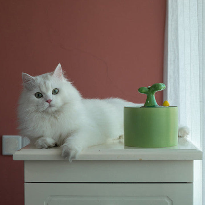 Modern silent ceramic cat fountain with filtered water, ensuring pets stay hydrated and healthy effortlessly.