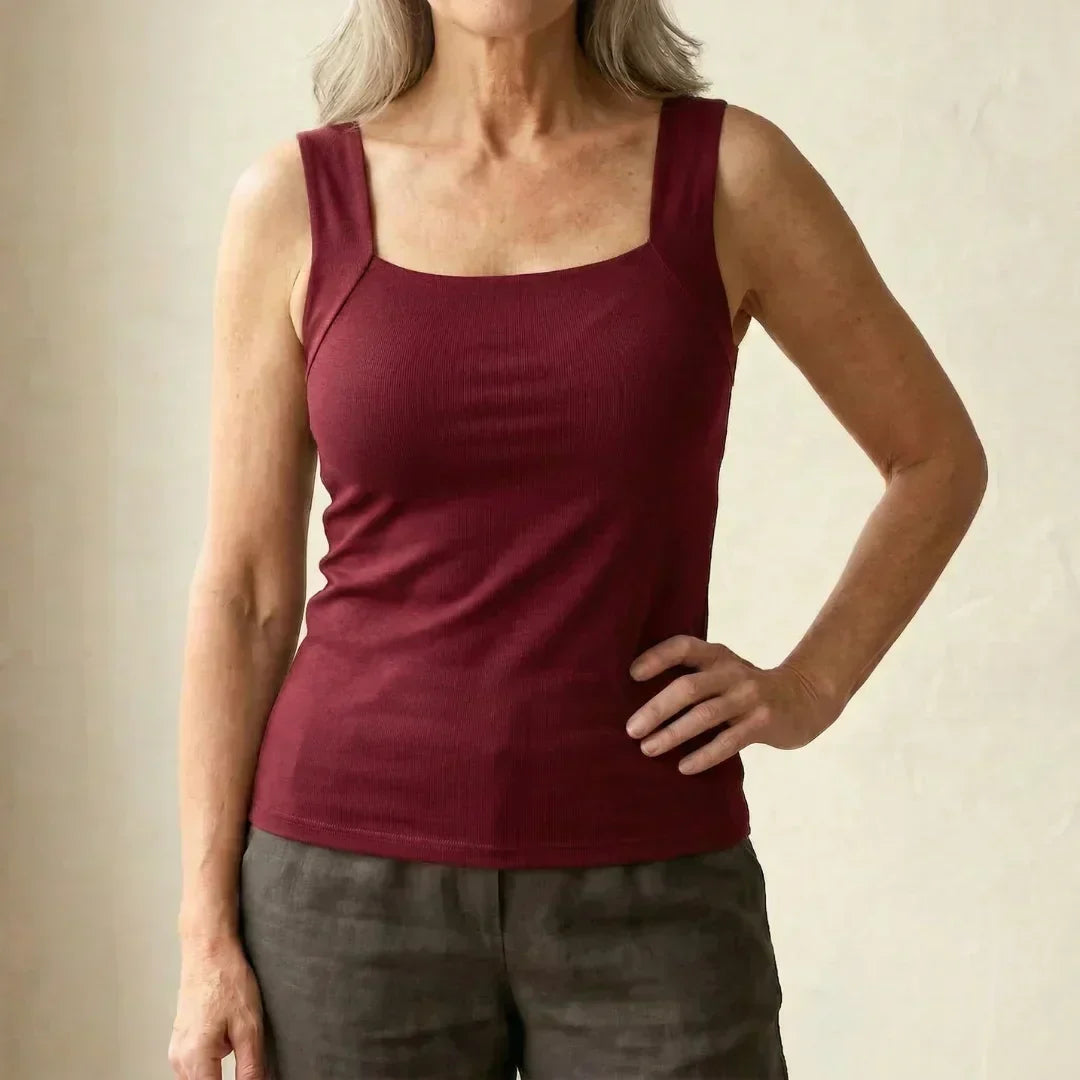 Versatile women's support top, black seamless built-in bra tank for any occasion.