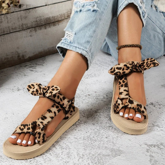 Elegant women's leopard print fashion sandals, comfortable animal print slip-ons for summer style.