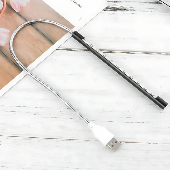 Dimmable LED computer light, USB powered with a flexible gooseneck, ideal for late-night typing.