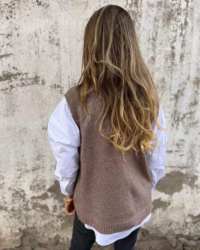 Comfortable women's knit vest. A chic sleeveless top for casual wear and elegant fall fashion layering.