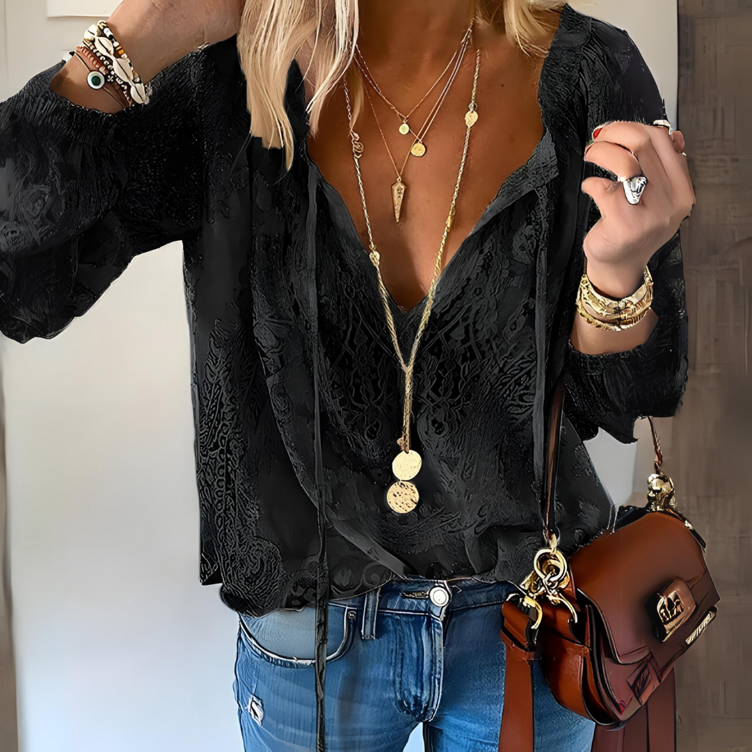 Stylish women's relaxed fit boho blouse with v-neck and lace accents for casual wear.