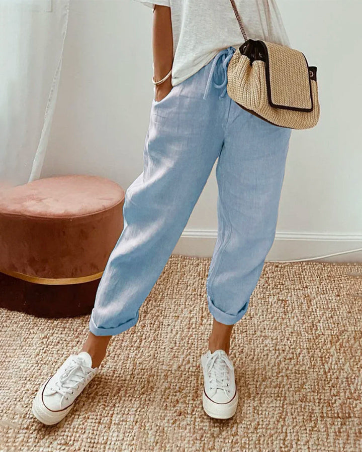 Relaxed fit women's tapered drawstring pants, high-waist casual trousers, ideal for everyday style.