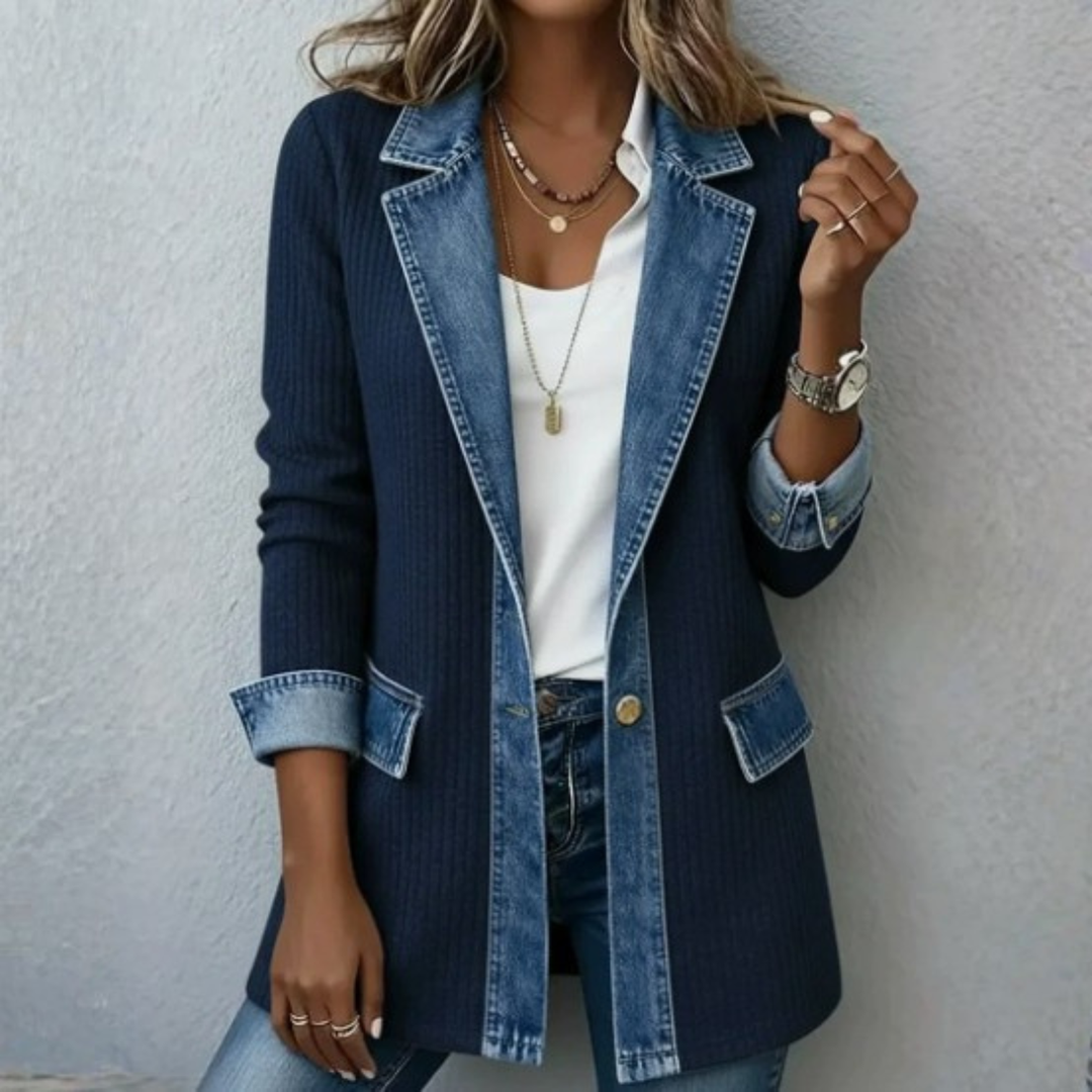 Detail shot of the chic lapel collar on a women's denim patchwork jacket, a trendy button-down outerwear.
