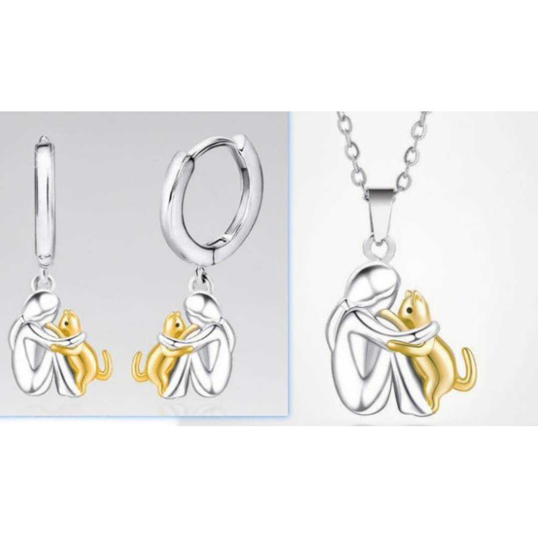 Close-up of a women's pendant necklace, intricate girl & dog embrace charm, ideal for pet lovers.