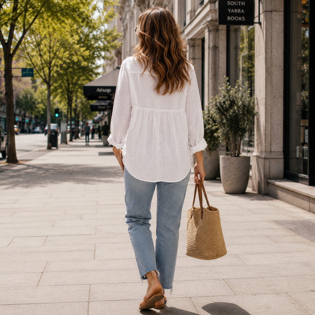 White women's button-down blouse, long sleeve collared top. Ideal for office wear, professional & casual.