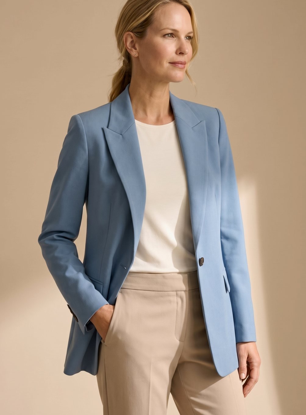 Women's elegant suit: a chic blazer and flared trousers two-piece set for sophisticated office & formal attire.