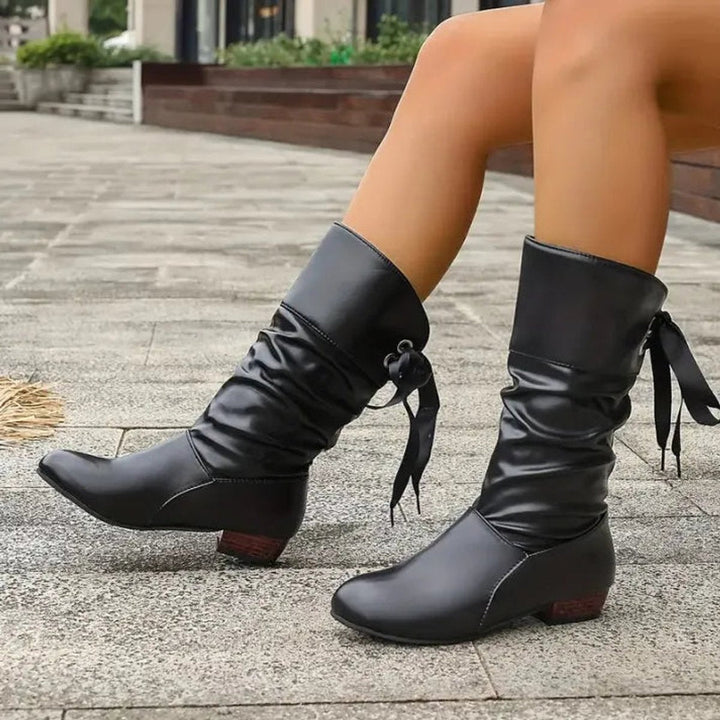 Red women's fashion ankle boots, slouchy design with lace-up detail & comfortable block heel.