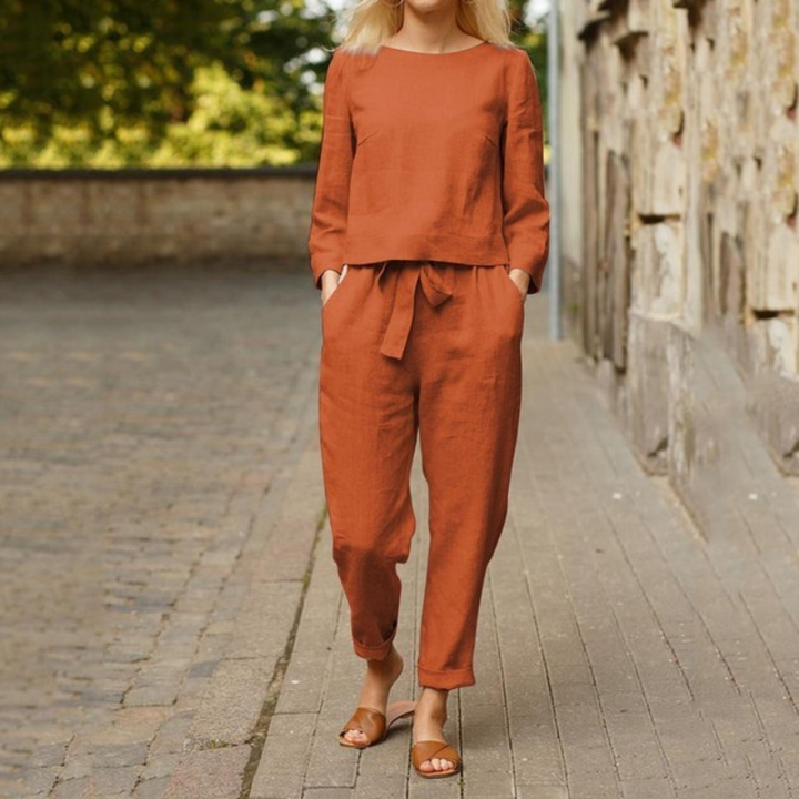 Comfortable women's two-piece set with a chic long-sleeve blouse & stylish pants, perfect for spring/summer.