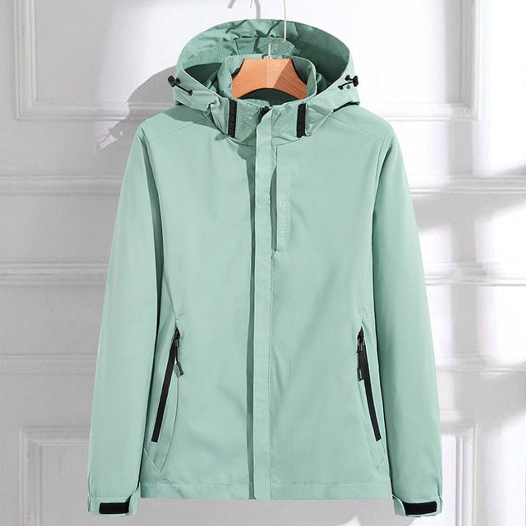 Women's waterproof rain jacket with adjustable hood, perfect for outdoor activities & travel. Lightweight & weatherproof.