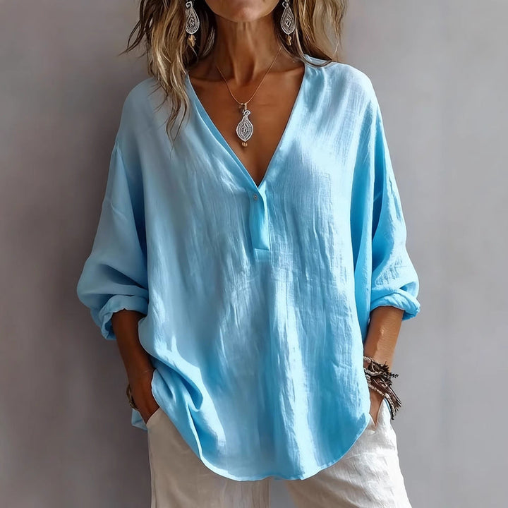 Solid color loose-fit long-sleeve top for women, ideal for layering or stand-alone in spring/autumn fashion.