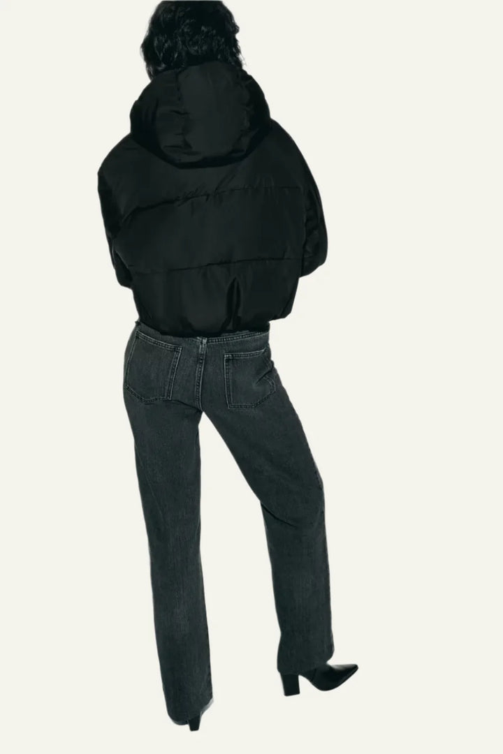 Essential women's black puffer jacket, providing warmth without bulk. Your go-to lightweight winter coat.