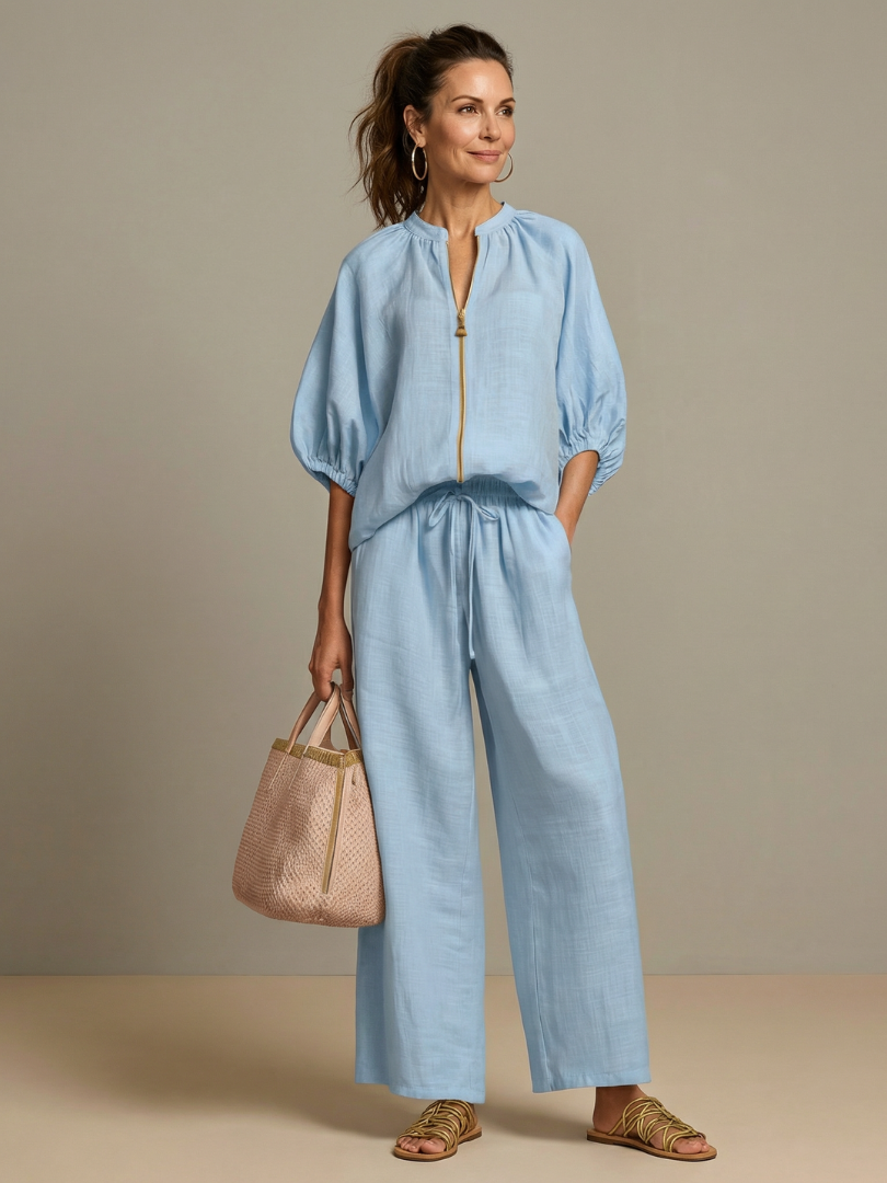 Women's stylish zip-front blouson top & wide-leg pants two-piece set for spring.