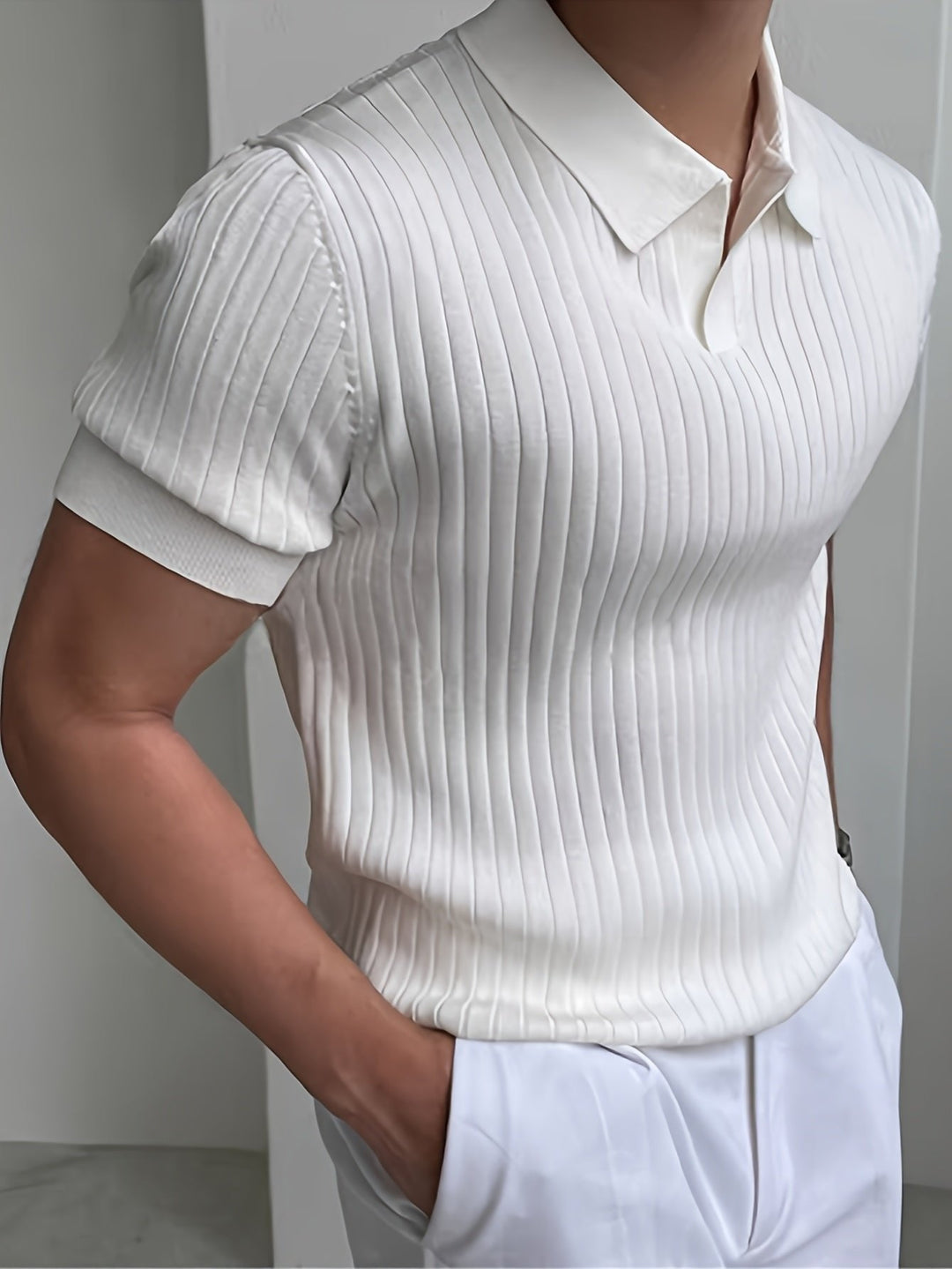 Modern men's ribbed polo, a versatile top perfect for smart casual fashion. Tailored fit.