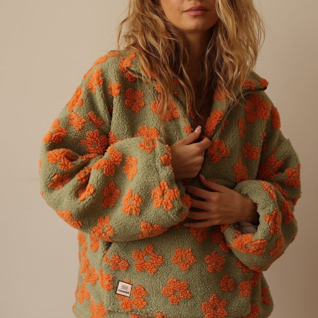Warm floral print oversized half-zip sweater for women, a cozy pullover for stylish winter comfort.