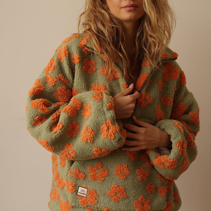 Warm floral print oversized half-zip sweater for women, a cozy pullover for stylish winter comfort.