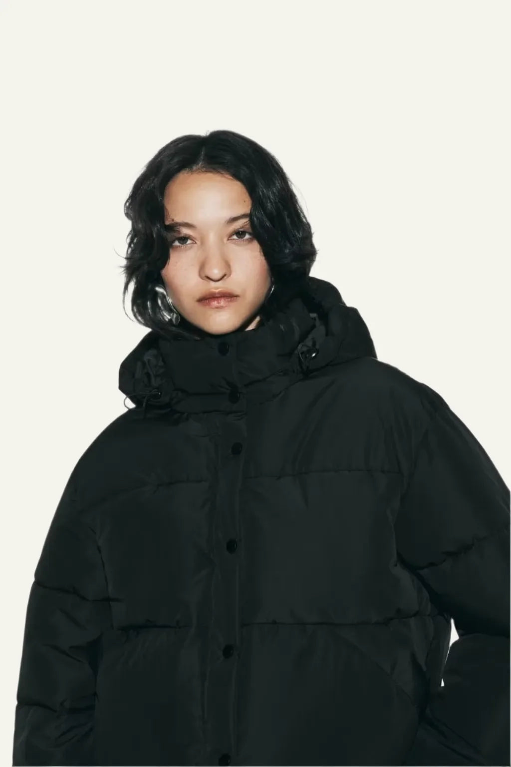 Stylish women's black puffer coat. Lightweight, warm winter outerwear for everyday fashion.