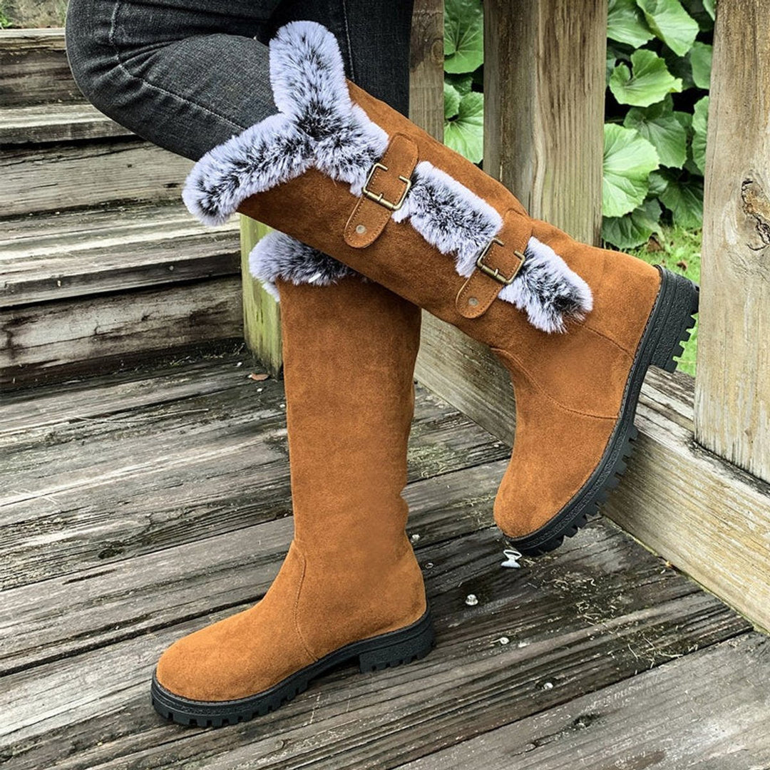 Black women's fur-trim knee-high boots with buckle details, round toe, for chic winter style.
