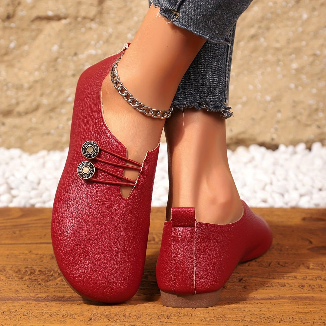 Timeless style women's loafers, soft slip-on shoes with a rounded toe and decorative detail.