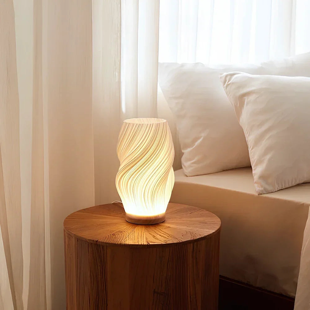 Ambient light from a dimmable Wavecrest lamp, elegant wave design, perfect for decor.