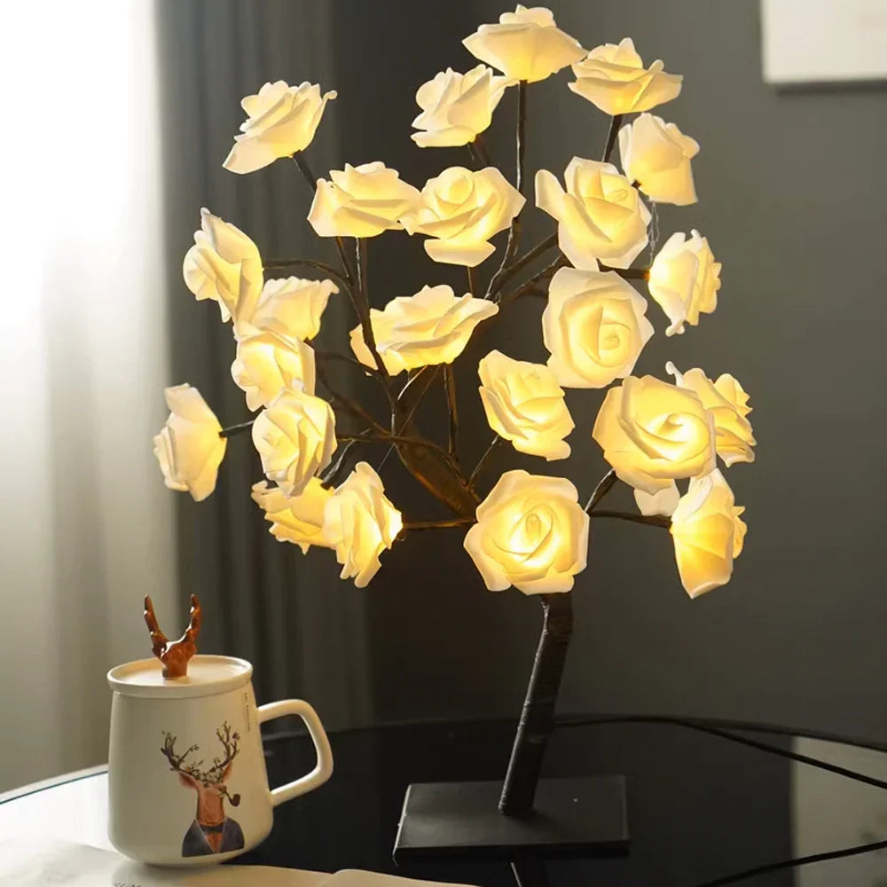 Delicate LED rose petals illuminate this beautiful bonsai tree lamp with warm white light.
