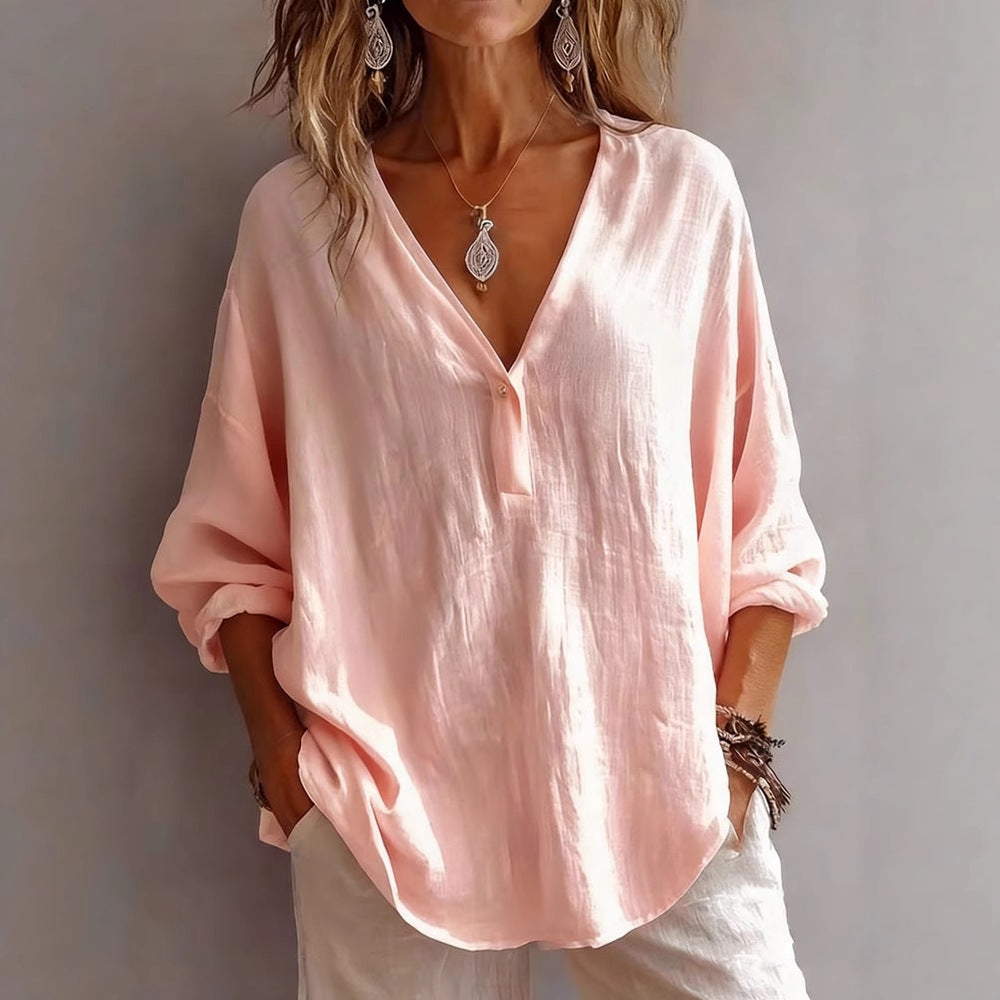 Comfortable women's long-sleeve top, loose fit, solid color. Versatile for casual wear or office attire.