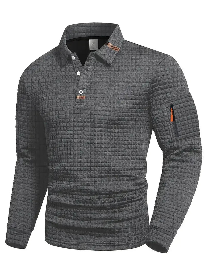 Close-up of a men's stylish textured long-sleeve polo shirt, featuring a unique geometric pattern.