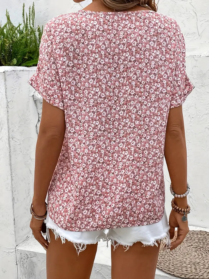 Feminine floral blouse for women featuring a relaxed fit & stylish button accents, ideal for versatile fashion.