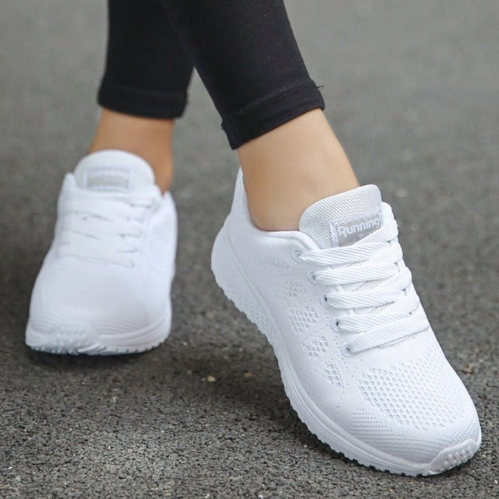Stylish black women's orthopedic walking sneakers, designed for all-day comfort, support, and active wear.